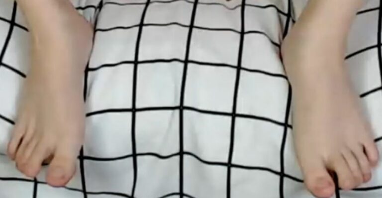 Feet on a grid-blanket surface Foot Fetish