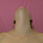 Person with head tilted back