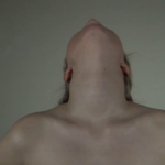 Person with head tilted back